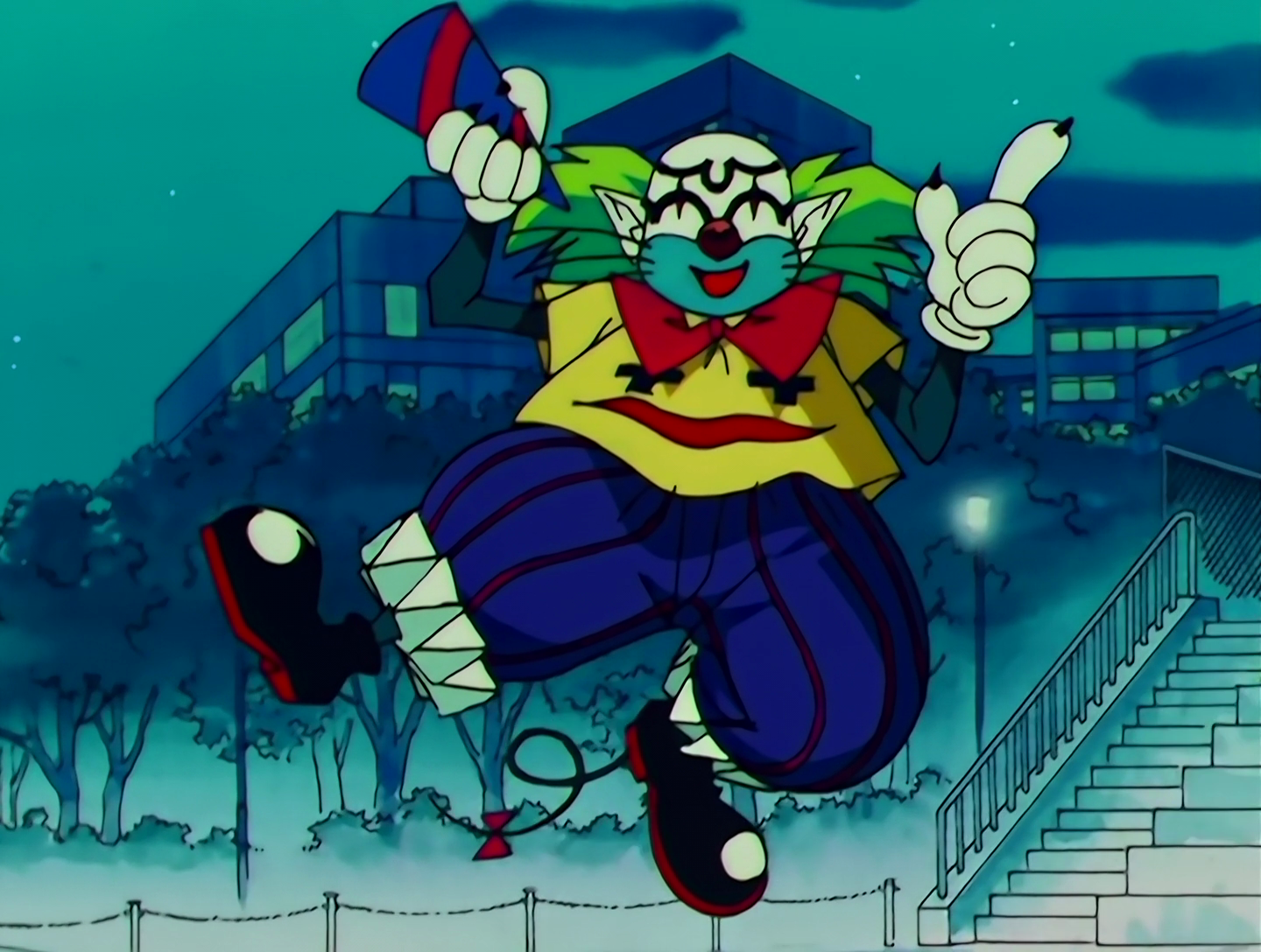 Mister Magic Pierrot, a Lemures from Sailor Moon episode 149. He resembles a short, jovial clown in blue and yellow, with white and blue face paint. He has whiskers like a cat, not sure what’s going on there. His shirt has a creepy face on it. He’s wearing the white gloves beloved by many a cartoon character, but they have black claws protruding from them. His weapon is a conical party hat that he uses to launch bombs.